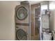 Modern laundry room with gray stacked washer and dryer at 11023 Bellatrix Ct, Las Vegas, NV 89135