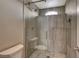 Large walk-in shower with vertical tile and a frameless glass door at 11023 Bellatrix Ct, Las Vegas, NV 89135