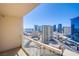 City views from a balcony with clear glass railings in a high-rise condo, sunny skies at 135 E Harmon Ave # 2821, Las Vegas, NV 89109