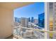 Stunning city views from a private balcony with glass railings in a high-rise condominium at 135 E Harmon Ave # 2821, Las Vegas, NV 89109