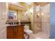 Elegant bathroom featuring a granite countertop vanity and a glass-enclosed walk-in shower at 135 E Harmon Ave # 2821, Las Vegas, NV 89109