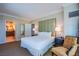 Comfortable bedroom with neutral decor, plush carpet, and an ensuite bath at 135 E Harmon Ave # 2821, Las Vegas, NV 89109