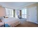 Bright bedroom with oversized windows, comfortable seating and carpeting at 135 E Harmon Ave # 2821, Las Vegas, NV 89109