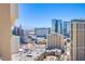 Wide city view featuring multiple high-rise buildings and mountains in the distance at 135 E Harmon Ave # 2821, Las Vegas, NV 89109