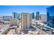 Wide city view featuring multiple high-rise buildings and blue sky at 135 E Harmon Ave # 2821, Las Vegas, NV 89109