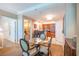 A well-lit dining area next to the kitchen and living area with seating for four at 135 E Harmon Ave # 2821, Las Vegas, NV 89109