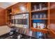 Kitchen cabinetry showing stainless steel microwave and neatly organized glassware and dishware at 135 E Harmon Ave # 2821, Las Vegas, NV 89109