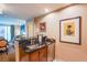 Stylish kitchen area featuring dark granite countertops, wood cabinets, and stainless steel appliances at 135 E Harmon Ave # 2821, Las Vegas, NV 89109