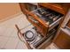 Kitchen drawer containing a pull-out colander with ample storage space at 135 E Harmon Ave # 2821, Las Vegas, NV 89109