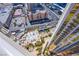 High-angle view of a pool surrounded by tables, trees and building at 135 E Harmon Ave # 2821, Las Vegas, NV 89109