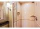 Luxurious walk-in shower featuring tan tile and a large, modern shower head at 135 E Harmon Ave # 2821, Las Vegas, NV 89109