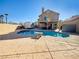 A refreshing backyard pool with a lounge area and a covered patio for outdoor entertaining at 1508 Splinter Rock Way, North Las Vegas, NV 89031