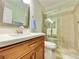 Bathroom featuring a modern vanity, brushed nickel faucet, and glass shower at 1508 Splinter Rock Way, North Las Vegas, NV 89031