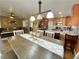 Open concept dining room with modern lighting fixtures, and seamless access to the kitchen and living areas at 1508 Splinter Rock Way, North Las Vegas, NV 89031