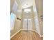 Inviting foyer with a high ceiling, modern light fixture, and beautiful wood-look flooring at 1508 Splinter Rock Way, North Las Vegas, NV 89031