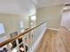 Hallway overlooking the entryway with wood floors and a railing at 1508 Splinter Rock Way, North Las Vegas, NV 89031