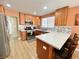 Well-equipped kitchen with stainless appliances, quartz countertops, wood cabinets, and breakfast bar seating at 1508 Splinter Rock Way, North Las Vegas, NV 89031