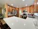 Bright kitchen with stainless steel appliances, ample counter space, and classic wood cabinetry at 1508 Splinter Rock Way, North Las Vegas, NV 89031