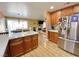 Spacious kitchen featuring stainless steel appliances and an open floorplan flowing into the dining area at 1508 Splinter Rock Way, North Las Vegas, NV 89031