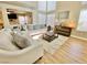 Inviting living room featuring a plush rug, wood floors and modern furnishings, creating a comfortable space at 1508 Splinter Rock Way, North Las Vegas, NV 89031