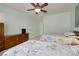 Spacious bedroom featuring twin beds and wooden dressers with ceiling fan at 1616 Langston Hughes St, Henderson, NV 89052