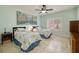 Bedroom showcasing twin beds, ceiling fan, and mint green walls for a relaxing atmosphere at 1616 Langston Hughes St, Henderson, NV 89052