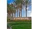 Sun City Anthem community sign surrounded by lush landscaping and mature palm trees, welcoming residents at 1616 Langston Hughes St, Henderson, NV 89052