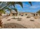 Lovely home exterior with a well-manicured gravel yard and lush desert landscaping, enhancing curb appeal at 1616 Langston Hughes St, Henderson, NV 89052