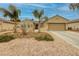 Charming single-story home with a two car garage and desert landscaping at 1616 Langston Hughes St, Henderson, NV 89052