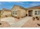 Attractive front entrance featuring desert landscaping with a walkway to the front door at 1616 Langston Hughes St, Henderson, NV 89052