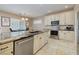 Well-equipped kitchen with granite countertops, stainless steel appliances, and ample cabinet space at 1616 Langston Hughes St, Henderson, NV 89052