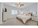 Cozy bedroom featuring carpet flooring, a ceiling fan, and neutral decor at 1646 Little Crow Ave, Las Vegas, NV 89123