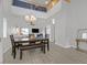 Open-concept dining area with wood floors and a chandelier at 1646 Little Crow Ave, Las Vegas, NV 89123