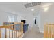 Bright and airy upstairs hallway with plush carpet and a comfortable blue sofa at 1646 Little Crow Ave, Las Vegas, NV 89123