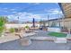 Inviting backyard with hot tub, outdoor seating, and a spiral staircase leading to a rooftop at 1805 Ivanhoe Way, Las Vegas, NV 89102