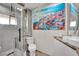 Bathroom featuring glass shower, decorative art, toilet and a modern sink at 1805 Ivanhoe Way, Las Vegas, NV 89102