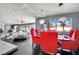 Unfinished dining room with a view of the house with dark floor and red chairs at 1805 Ivanhoe Way, Las Vegas, NV 89102