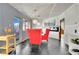 Dining room with bright red chairs and a view to the backyard at 1805 Ivanhoe Way, Las Vegas, NV 89102