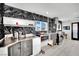 Modern kitchen with dark countertops, stainless steel appliances, geometric backsplash, and white cabinets at 1805 Ivanhoe Way, Las Vegas, NV 89102