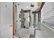 Modern bathroom featuring a glass-enclosed shower with gray and white marble-patterned tiles at 1805 Ivanhoe Way, Las Vegas, NV 89102