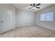 Bright bedroom with tile floors, a window, and neutral paint at 1881 W Alexander Rd # 1135, North Las Vegas, NV 89032