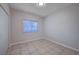 Bright bedroom featuring neutral walls, tiled floors, and a window for ample natural light at 1881 W Alexander Rd # 1135, North Las Vegas, NV 89032