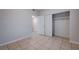 Cozy bedroom featuring a closet and access to an adjacent room at 1881 W Alexander Rd # 1135, North Las Vegas, NV 89032