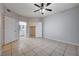 Bedroom featuring tile floors and access to an ensuite bathroom and closet at 1881 W Alexander Rd # 1135, North Las Vegas, NV 89032