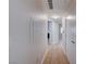 Neutral hallway featuring tile flooring, leading to multiple rooms in the house at 1881 W Alexander Rd # 1135, North Las Vegas, NV 89032