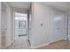 Hallway leading to the bathroom, with tile flooring and white walls at 1881 W Alexander Rd # 1135, North Las Vegas, NV 89032