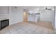 Spacious living room featuring tile flooring, a fireplace, and a view into the kitchen at 1881 W Alexander Rd # 1135, North Las Vegas, NV 89032