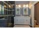 Luxurious bathroom featuring a glass shower, double sink vanity, and tile accents creating an elegant spa-like space at 1905 Sirocco Ct, Las Vegas, NV 89117