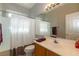 Bright bathroom featuring a shower-tub combination, vanity with sink, and ample lighting for daily routines at 1905 Sirocco Ct, Las Vegas, NV 89117