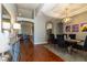 Elegant dining room with hardwood floors, tray ceilings, and modern chandelier at 1905 Sirocco Ct, Las Vegas, NV 89117